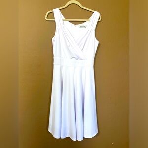 White low cut, short dress. For any occasion, sleeveless